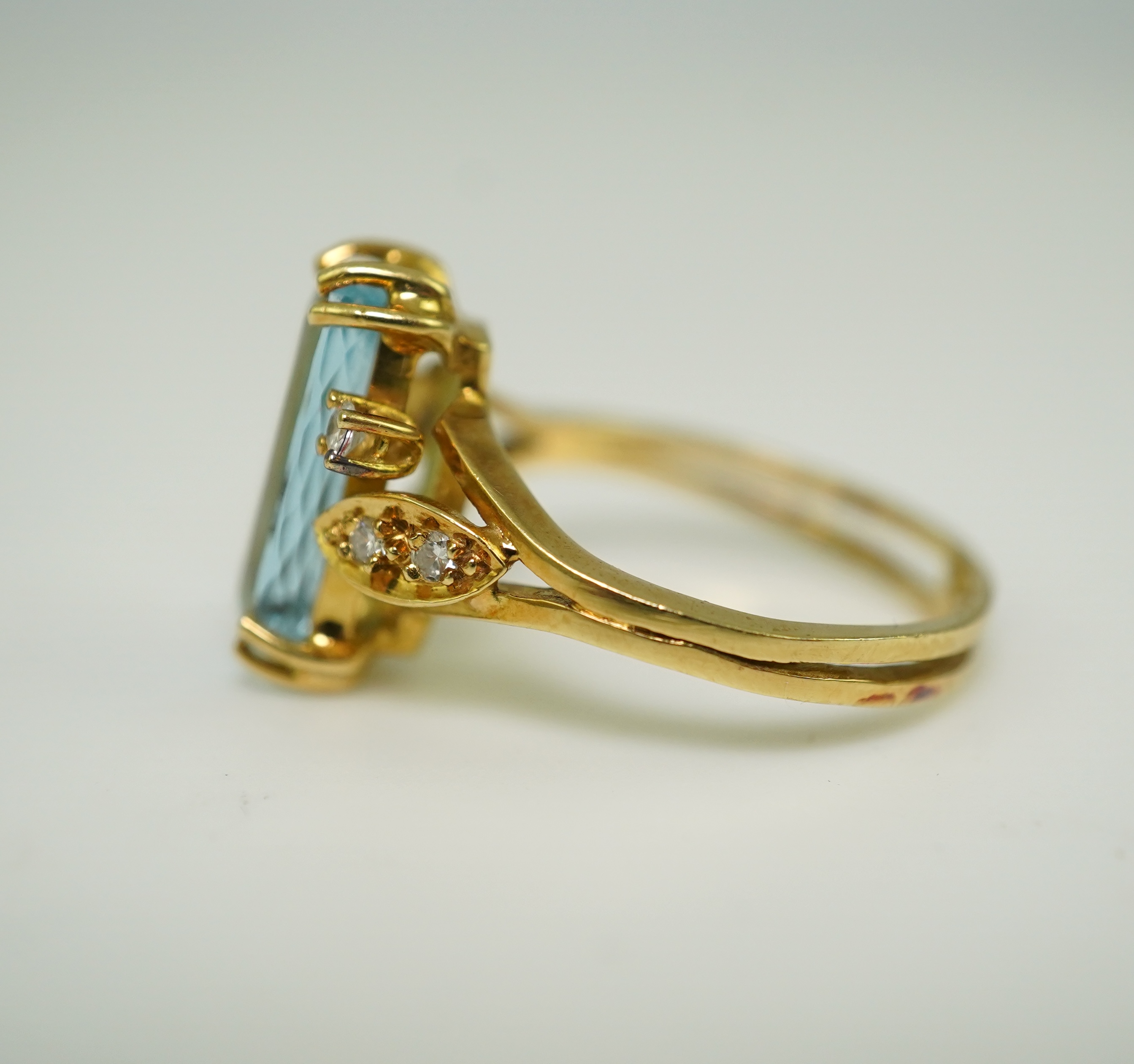 An aquamarine and diamond ring